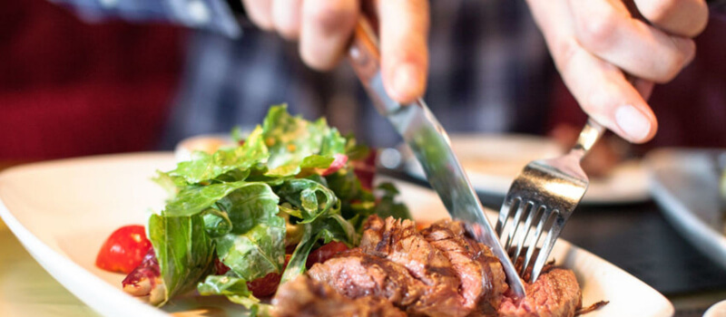 man eating at a restaurant